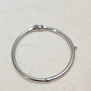 Kate Spade New York hinged silver bangle bracelet